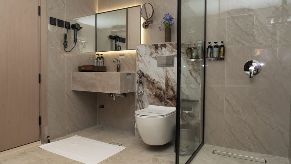 Shower, eco-friendly toiletries, hair dryer, slippers