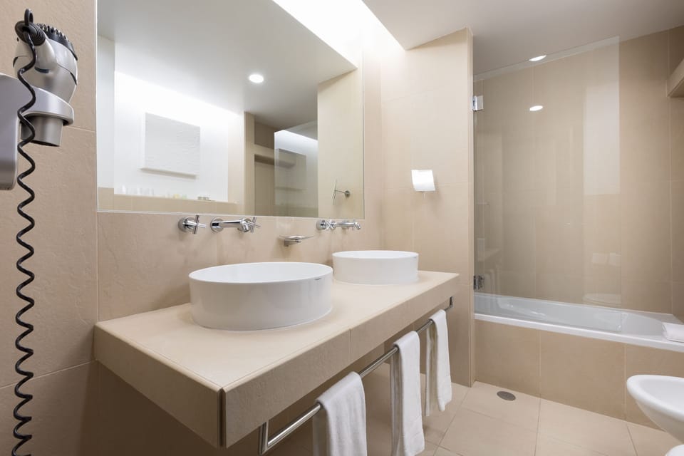 Shower, eco-friendly toiletries, hair dryer, slippers