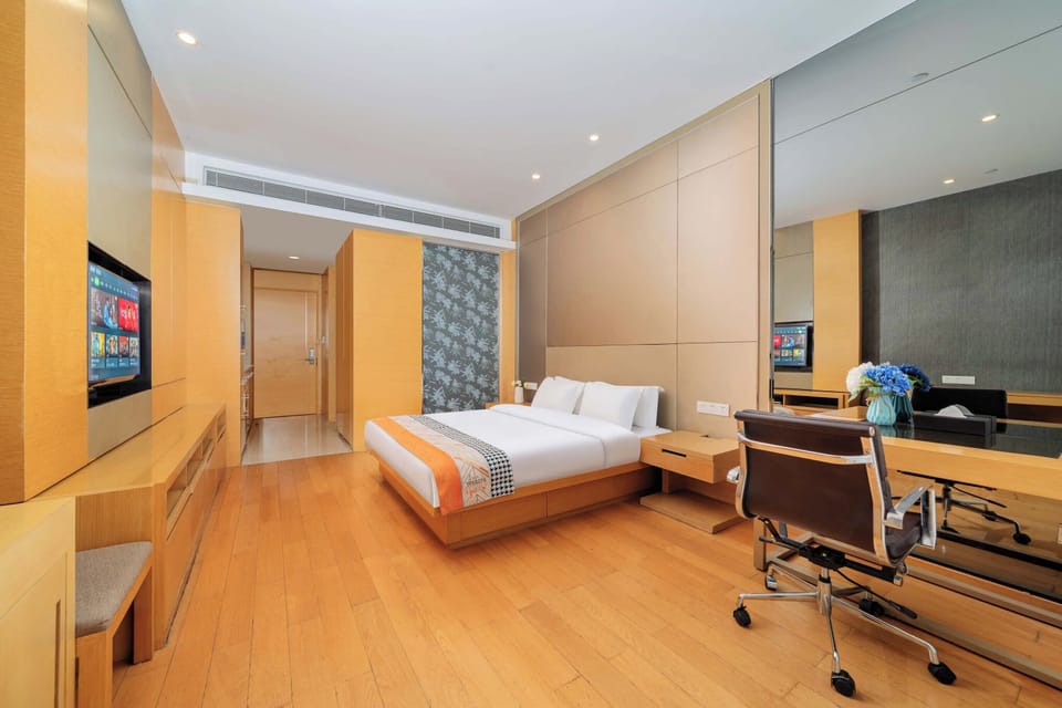 Superior Double Room, City View | Living area | TV