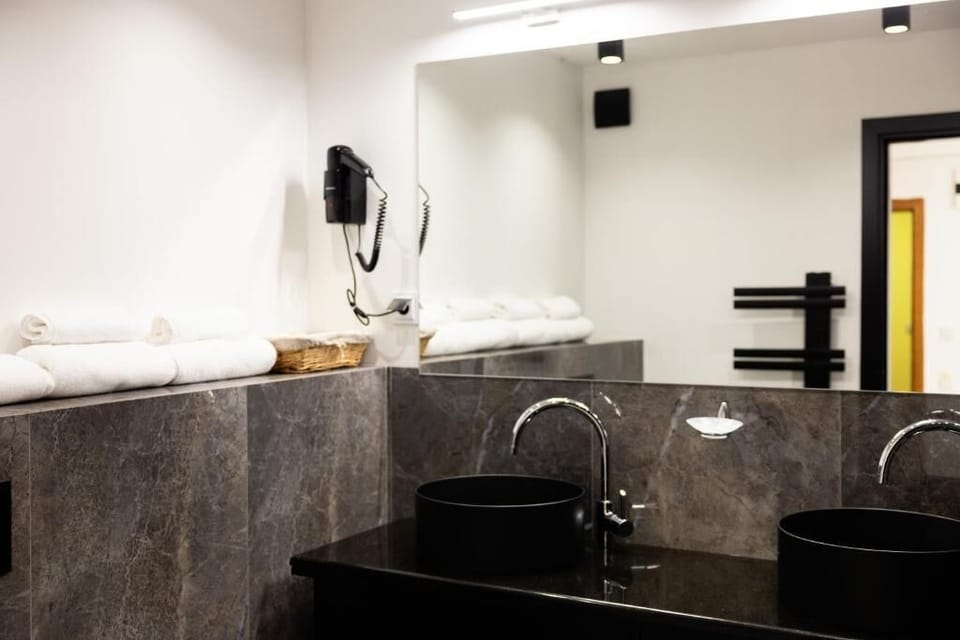 Panoramic Apartment, Balcony, Mountain View | Bathroom | Bathrobes, slippers, soap, shampoo