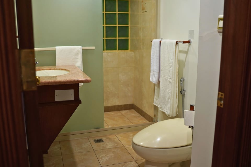 Shower, bathrobes, slippers, towels