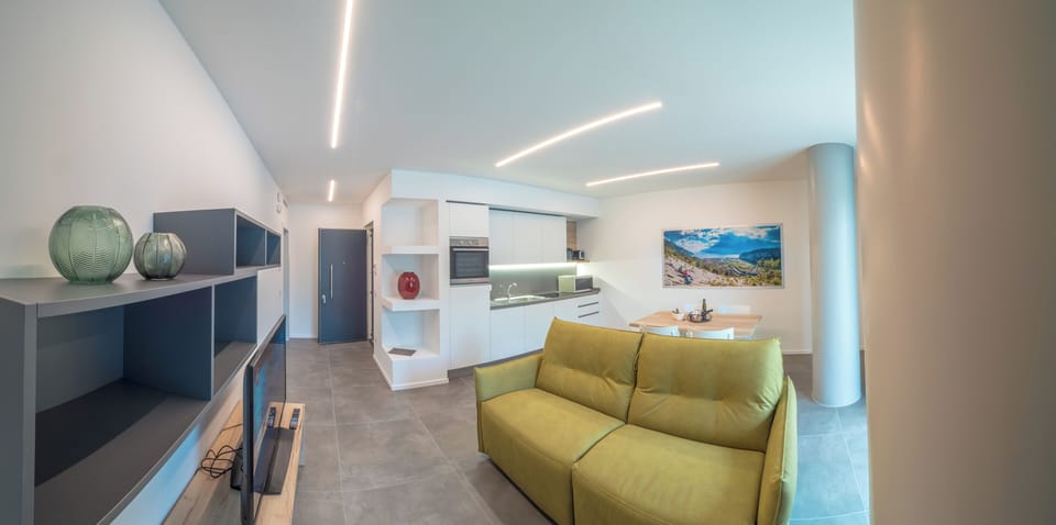 Comfort Apartment, Patio, Pool View | Living area | TV