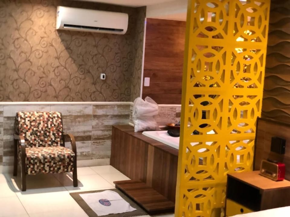 Luxury Suite, 1 Queen Bed | Living area | TV