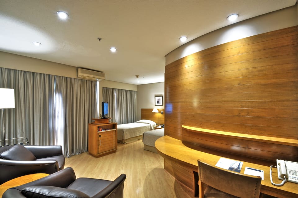 Standard Twin Room | Minibar, in-room safe, desk, soundproofing