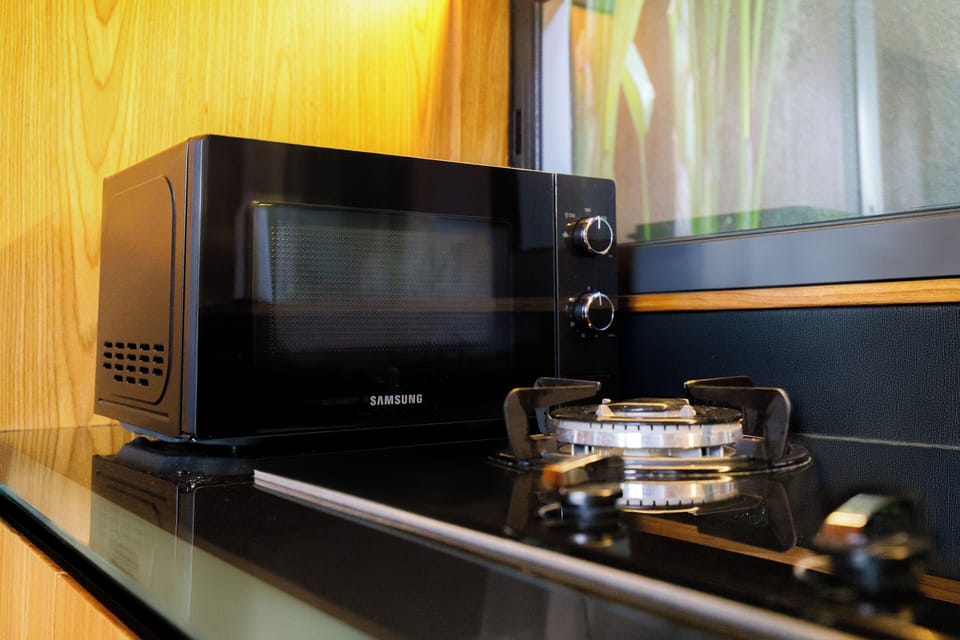 Superior Villa, Pool View | Private kitchen | Fridge, microwave, dishwasher, electric kettle