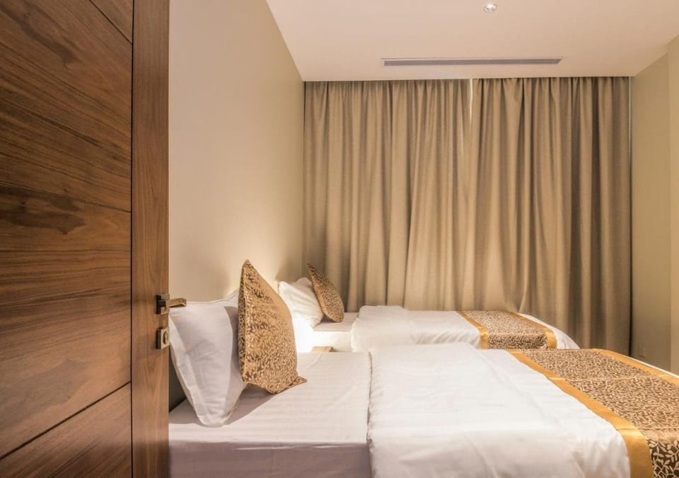 Suite, 2 Bedrooms | Blackout drapes, soundproofing, iron/ironing board, free WiFi