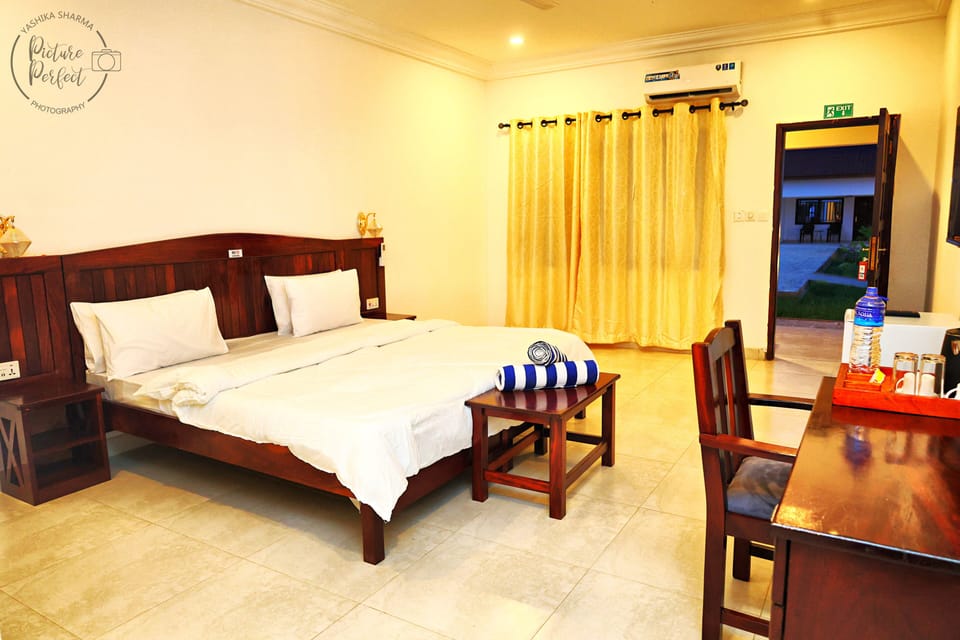 Deluxe Double or Twin Room, Pool View | In-room safe, desk, laptop workspace, iron/ironing board