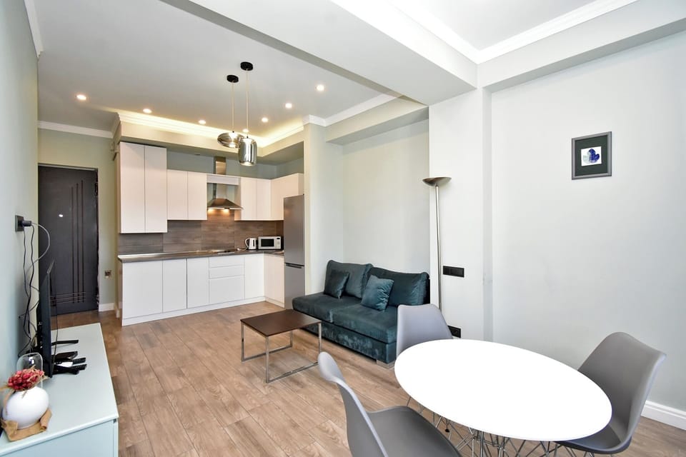 Classic Apartment, Balcony, City View | Living area | 50-inch flat-screen TV with cable channels