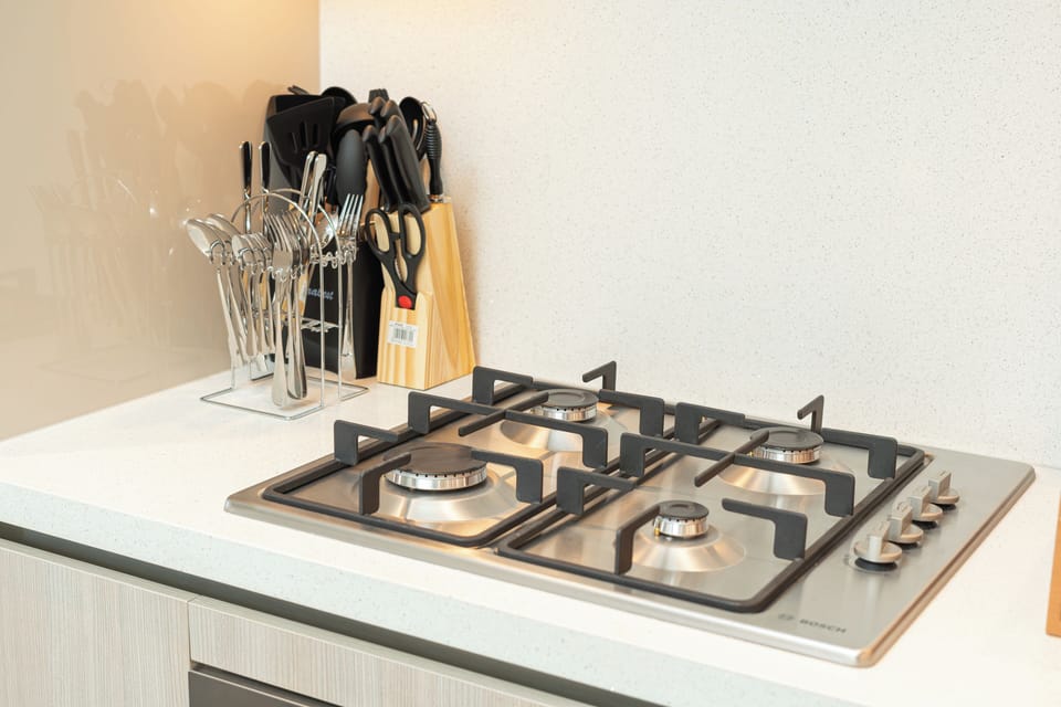 Design Apartment, Balcony, City View | Private kitchenette | Full-size fridge, microwave, oven, stovetop