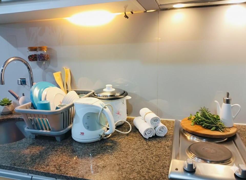 Mini-fridge, microwave, stovetop, cookware/dishes/utensils