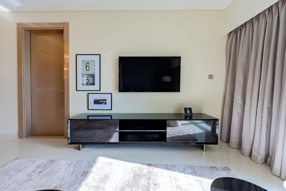 Deluxe Apartment, Balcony, City View | Living area | 55-inch Smart TV with digital channels