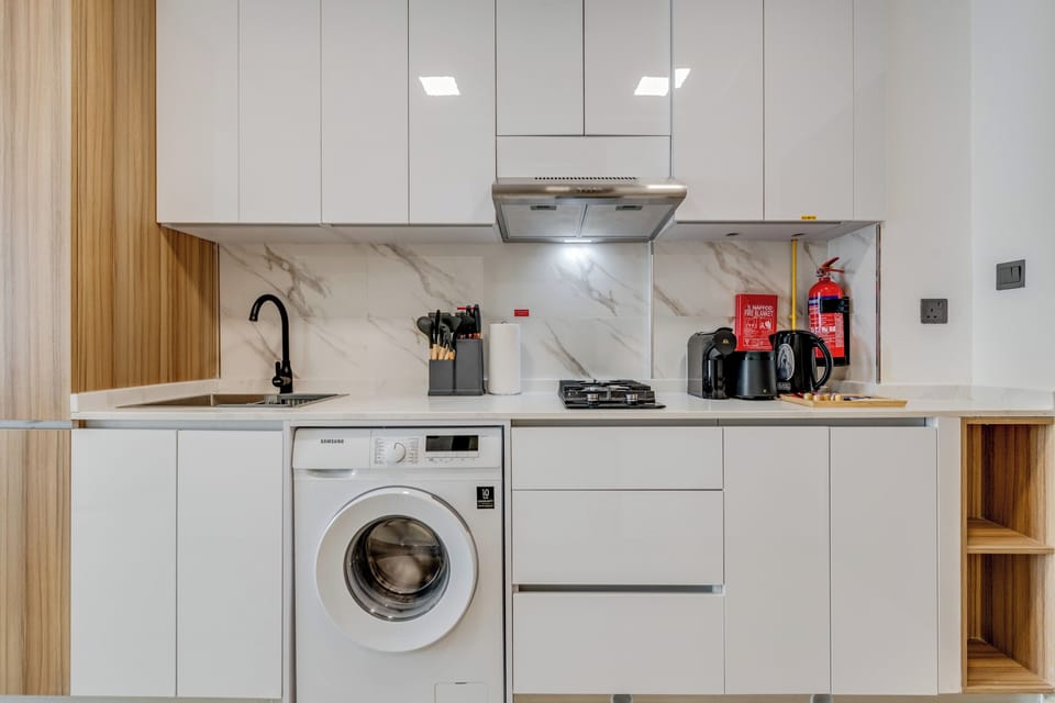 Deluxe Studio, 1 Queen Bed with Sofa bed, Balcony, City View | Private kitchen | Fridge, microwave, stovetop, coffee/tea maker