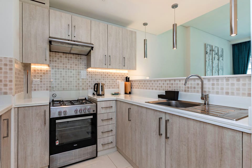 Superior Apartment, 1 Bedroom, Sea View | Living room | 50-inch Smart TV with digital channels