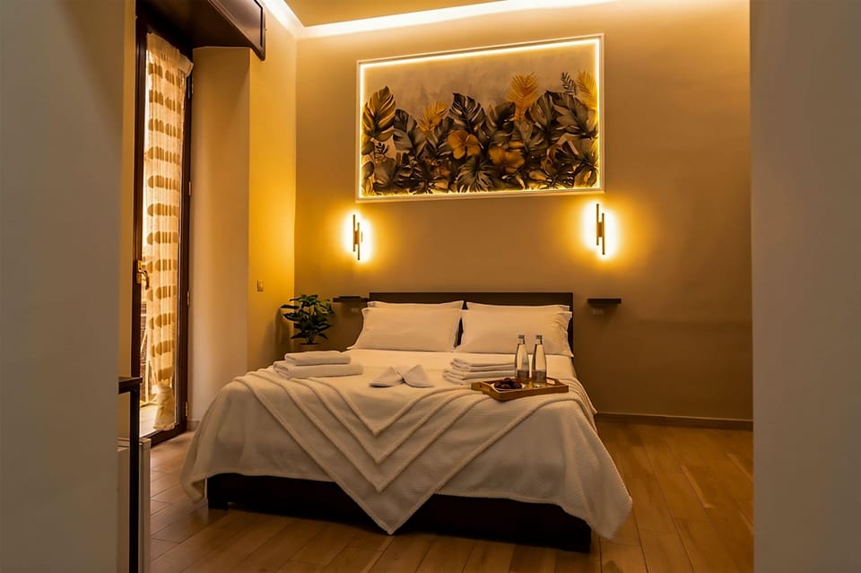 Triple Room, Private Bathroom | Minibar (free items), in-room safe, blackout drapes, soundproofing