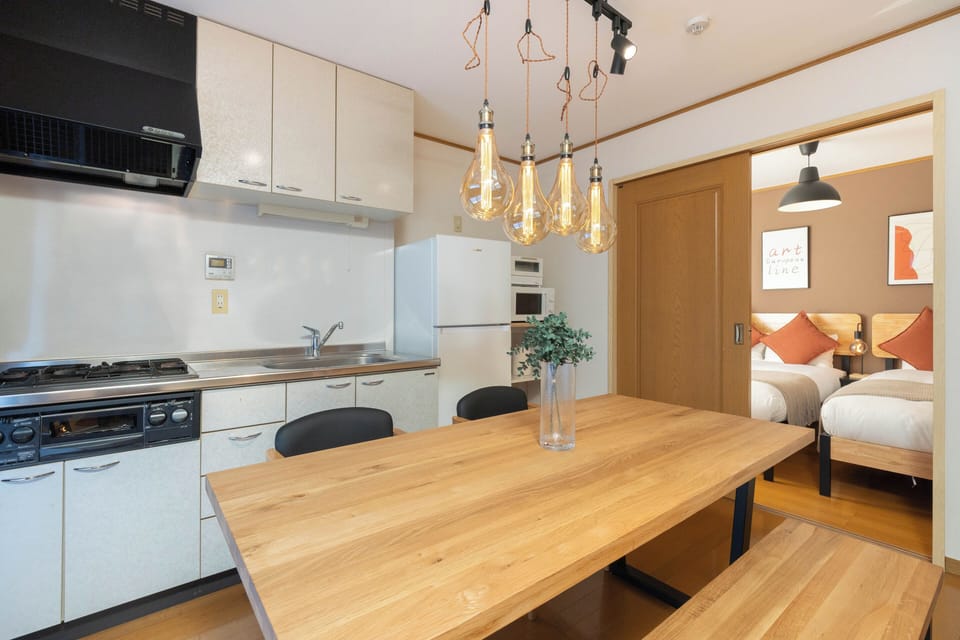 Apartment, Balcony | Living area | 65-inch flat-screen TV with digital channels
