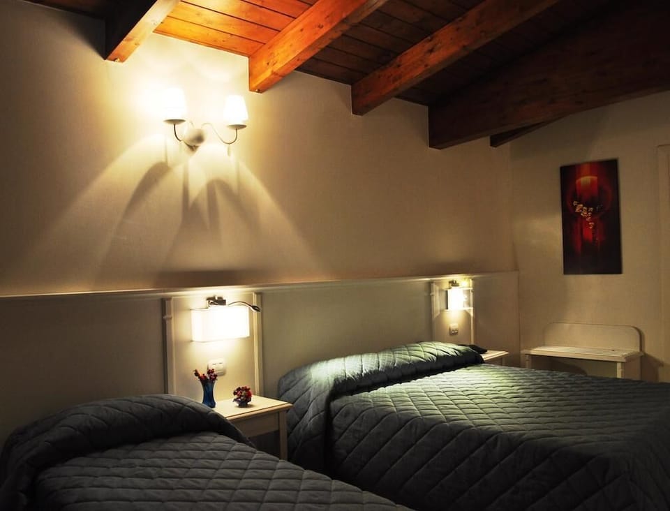 Family Quadruple Room, Balcony | In-room safe, desk, laptop workspace, blackout drapes