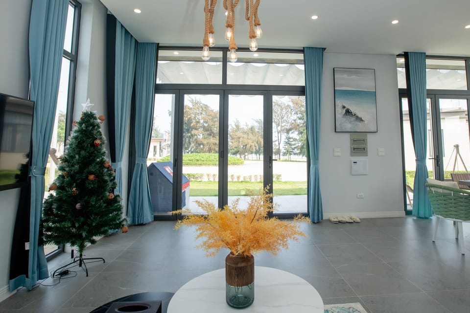 Deluxe Villa, 2 Bedrooms, Ocean View, Beachfront | Living area | 55-inch LED TV with cable channels