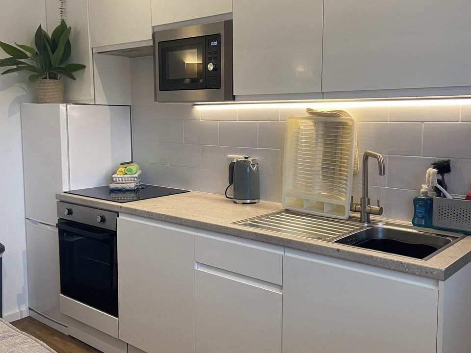 Fridge, microwave, cookware/dishes/utensils
