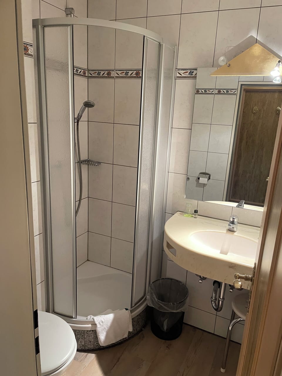 Shower, hair dryer, towels, toilet paper