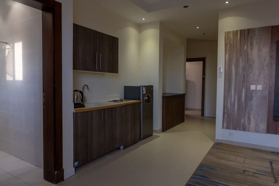 Family Suite, City View | Living area | TV