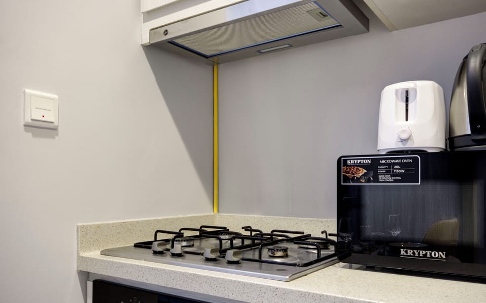 Deluxe Apartment, Balcony, City View | Private kitchen | Espresso maker, electric kettle
