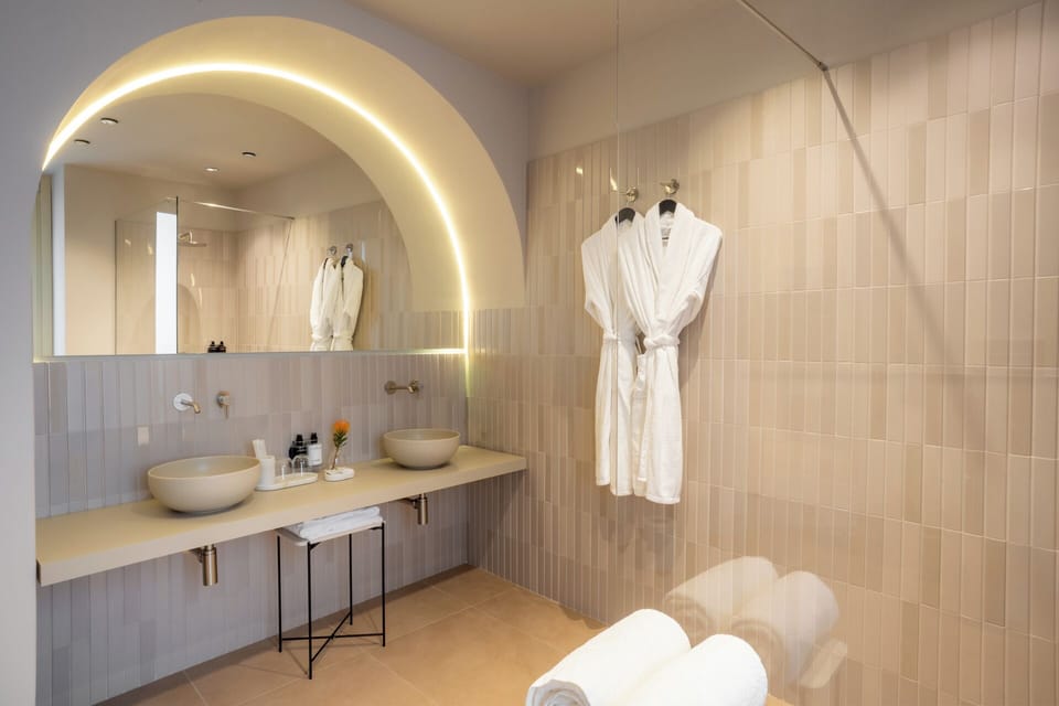 Grand Room, 1 King Bed with Sofa bed, City View | Bathroom | Shower, hair dryer, slippers, towels