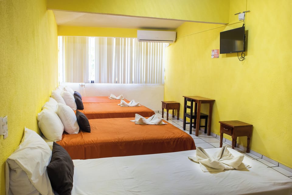 Family Quadruple Room, 1 Bedroom, Balcony, City View | Desk, blackout drapes, iron/ironing board (on request), WiFi (free)