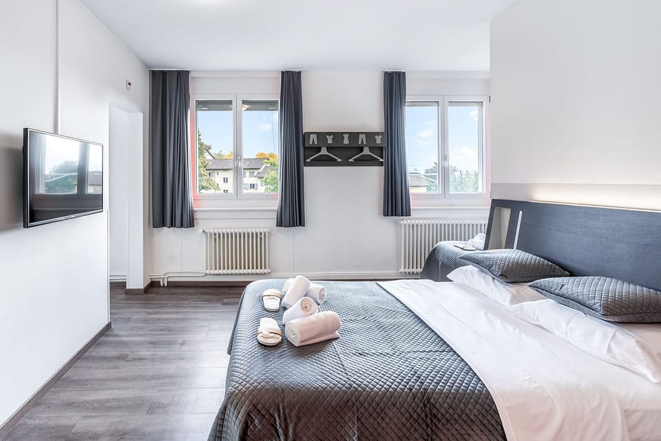 Family Quadruple Room, Multiple Beds, City View | Free WiFi, bed sheets