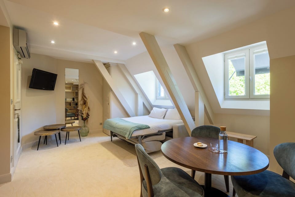 Suite, Balcony, River View | In-room safe, blackout drapes, iron/ironing board