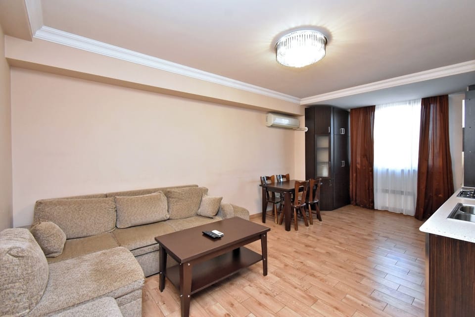 Economy Apartment | Living area | 50-inch flat-screen TV with cable channels