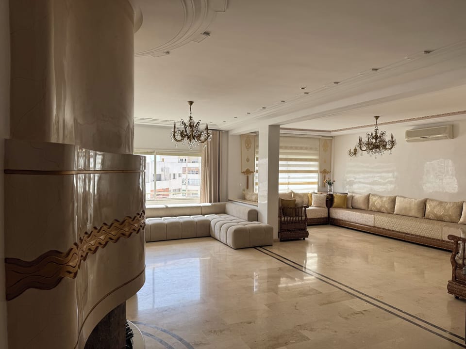 Deluxe Apartment, Balcony, City View | Living area | 150-cm Smart TV with satellite channels, fireplace