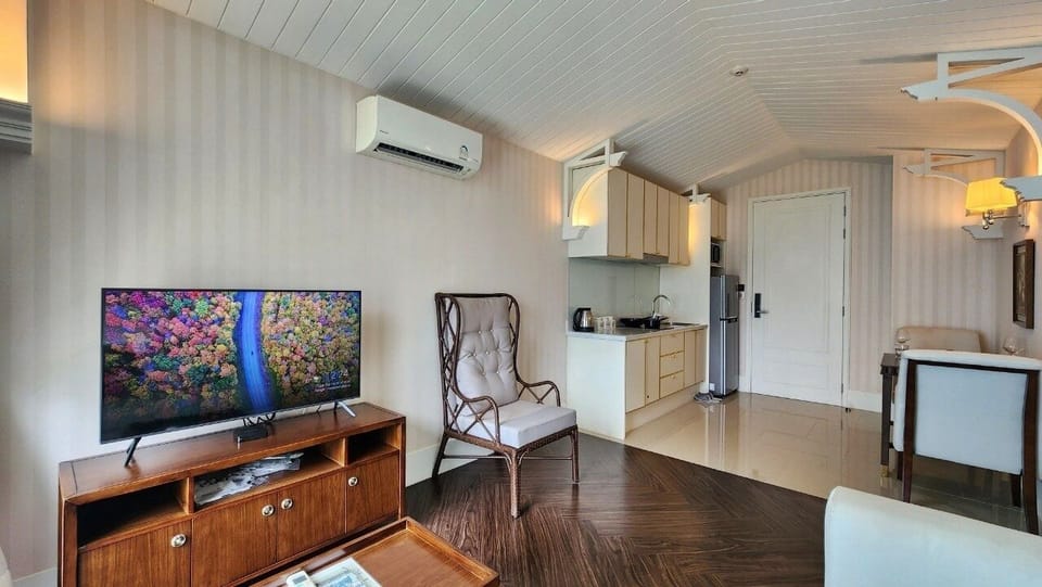 Condo, Balcony, Pool View | Living area | Flat-screen TV