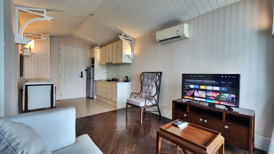 Condo, Balcony, Pool View | Living area | Flat-screen TV