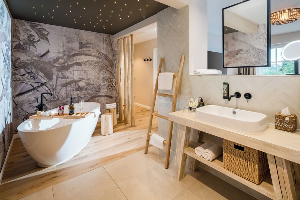 Deluxe Suite, 1 King Bed, Non Smoking | Premium bedding, minibar, in-room safe, individually decorated