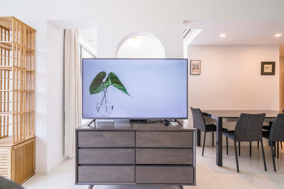Superior Apartment, 1 Bedroom, Kitchen, City View | Living room | 55-inch Smart TV with cable channels