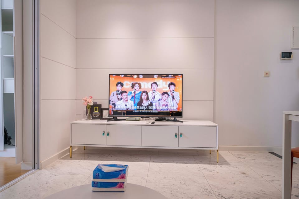 Superior Apartment, 1 Bedroom, Microwave, City View | Living room | 55-inch Smart TV with cable channels