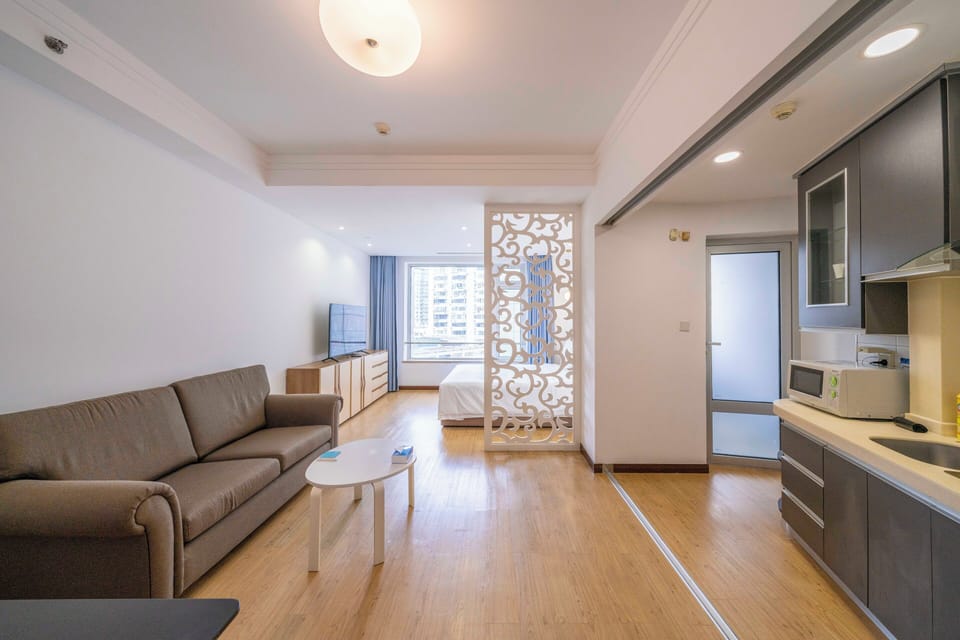 Superior Apartment, 1 Bedroom, Kitchen, City View | Living room | 55-inch Smart TV with cable channels