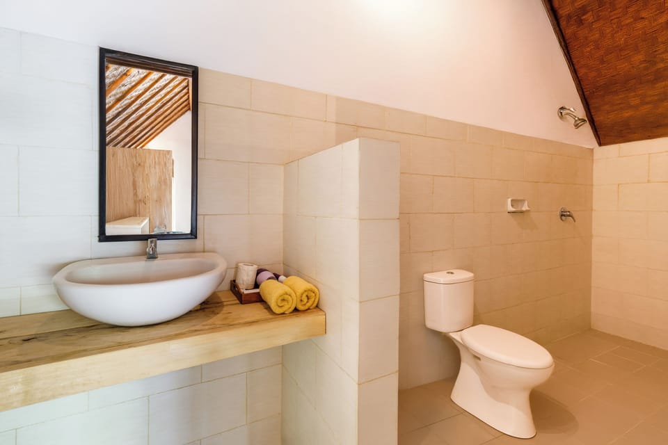 Standard Bungalow, Balcony, Pool View | Bathroom | Shower, slippers, bidet
