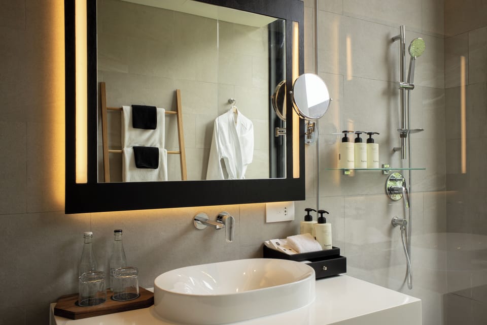 Designer toiletries, hair dryer, bathrobes, slippers