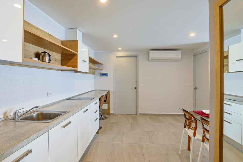 Apartment, Balcony | Private kitchenette | Full-size fridge, microwave, stovetop, electric kettle