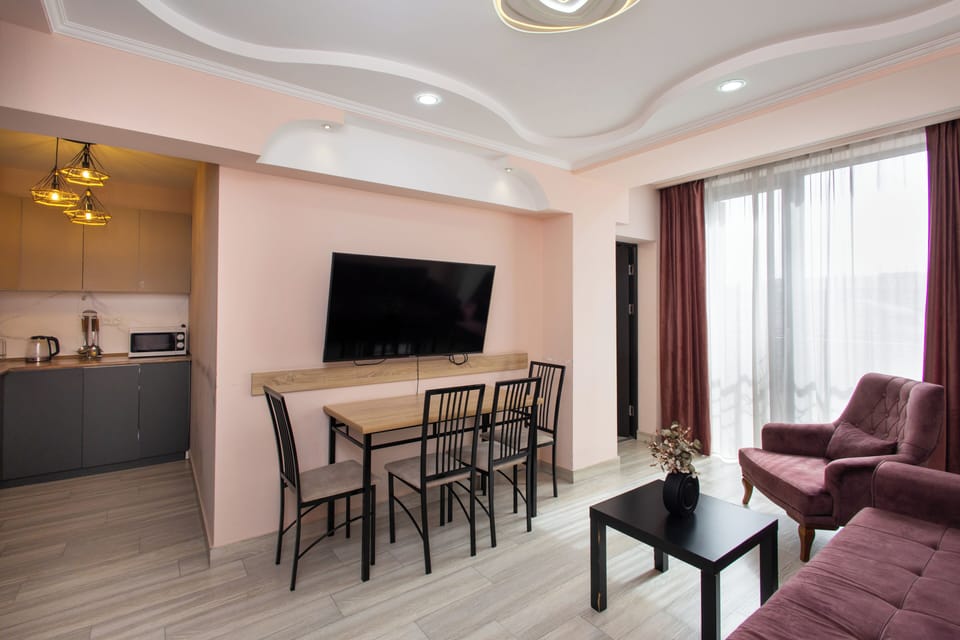 Standard Apartment, Balcony | Living area | 50-inch flat-screen TV with cable channels
