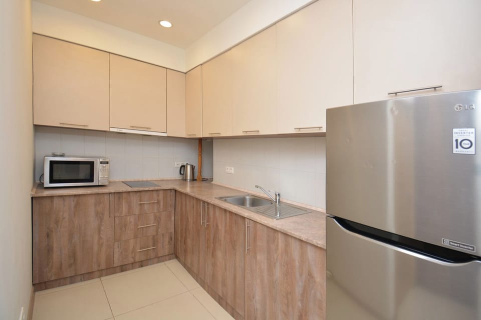 Family Apartment | Living area | 50-inch flat-screen TV with cable channels