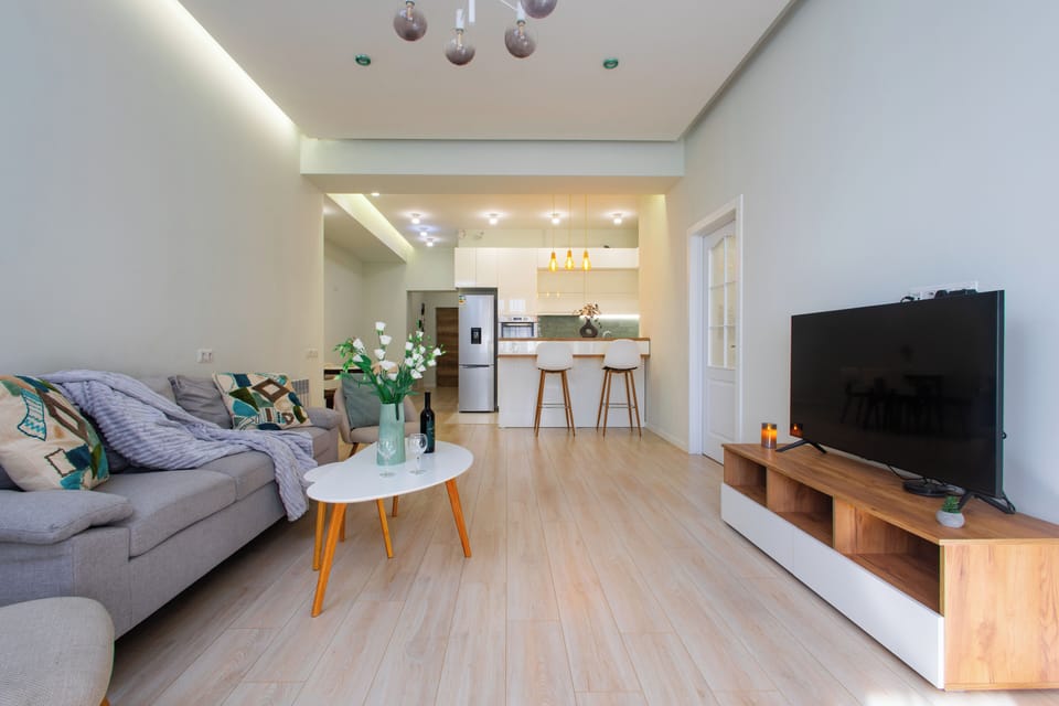 Family Apartment | Living area | 50-inch flat-screen TV with cable channels