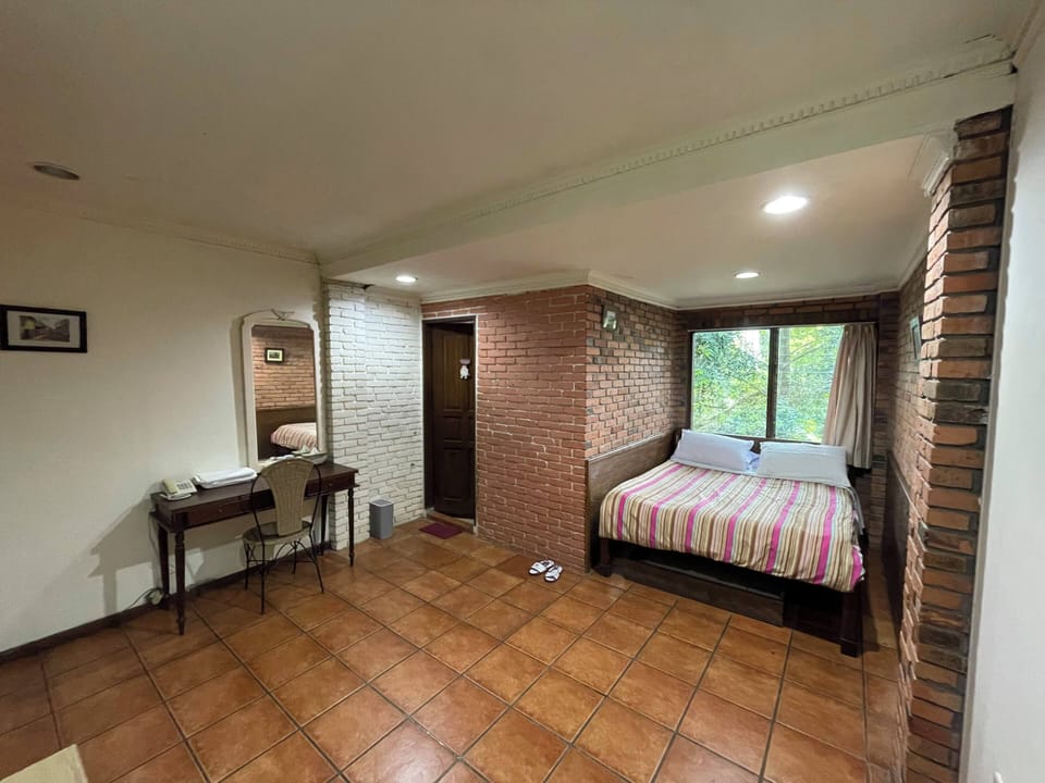 Deluxe Double Room, Garden View | Desk, laptop workspace, free WiFi