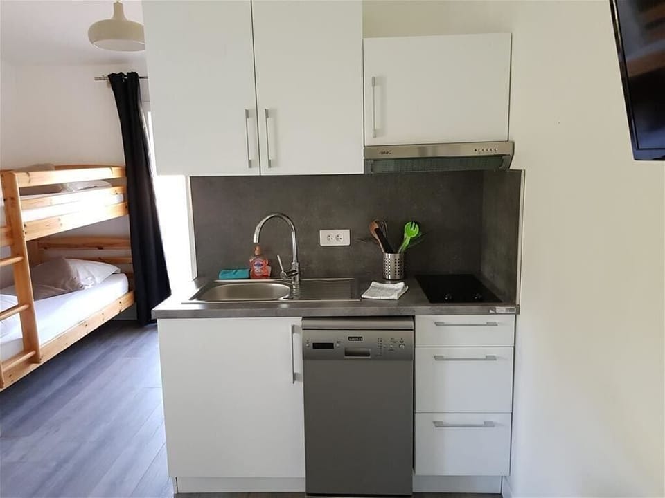 Family Studio, Garden View | Private kitchen | Microwave, coffee/tea maker, electric kettle