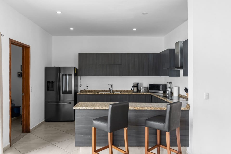 Villa | Private kitchen | Fridge, microwave, oven, stovetop