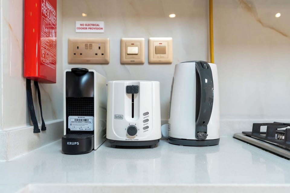 Signature Apartment, City View | Private kitchen | Fridge, microwave, oven, stovetop