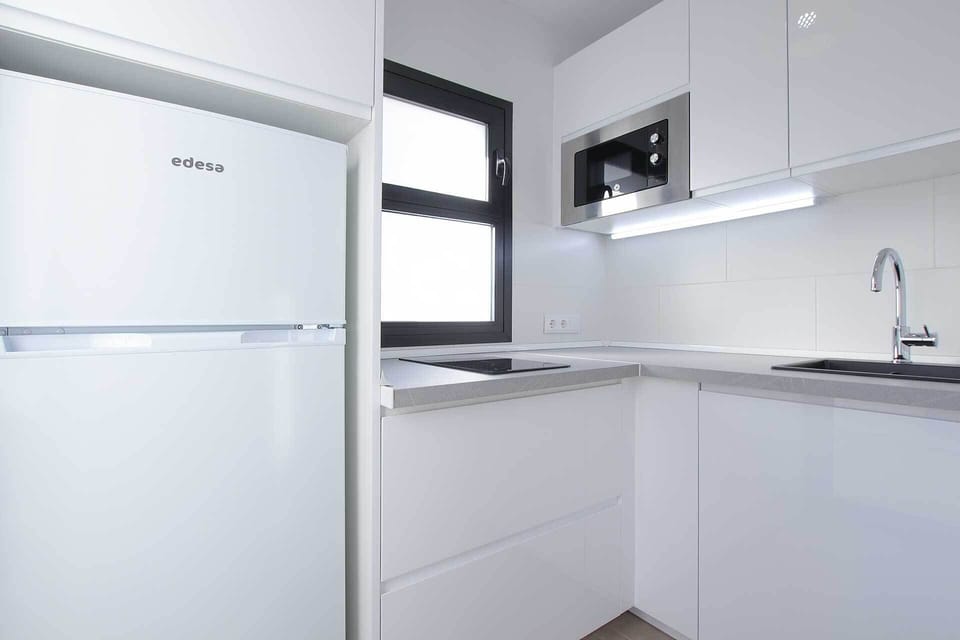 Comfort Apartment, Garden View | Private kitchen | Full-size fridge, microwave, stovetop, electric kettle