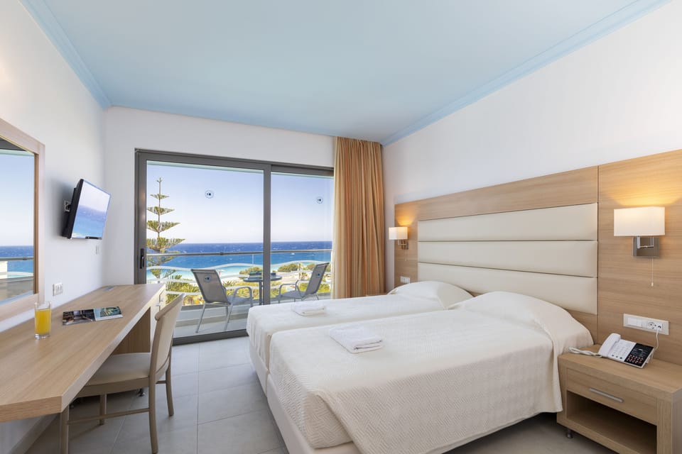 Superior Twin Room, Sea View | In-room safe, desk, laptop workspace, blackout drapes