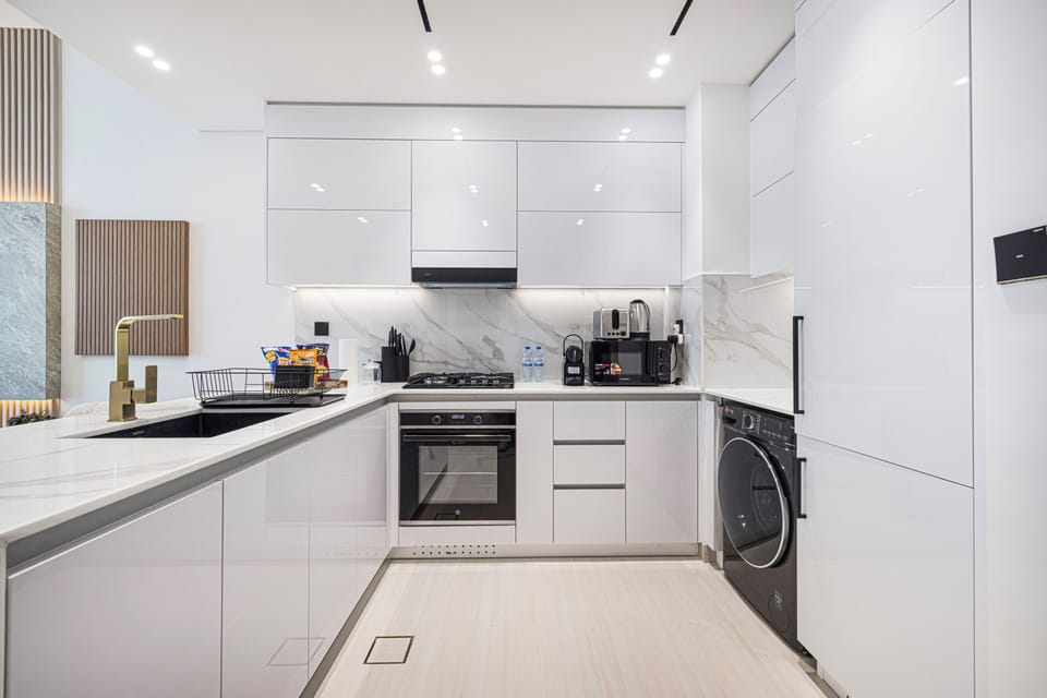 Deluxe Apartment, Balcony, City View | Private kitchen | Electric kettle, toaster, mixer, cleaning supplies